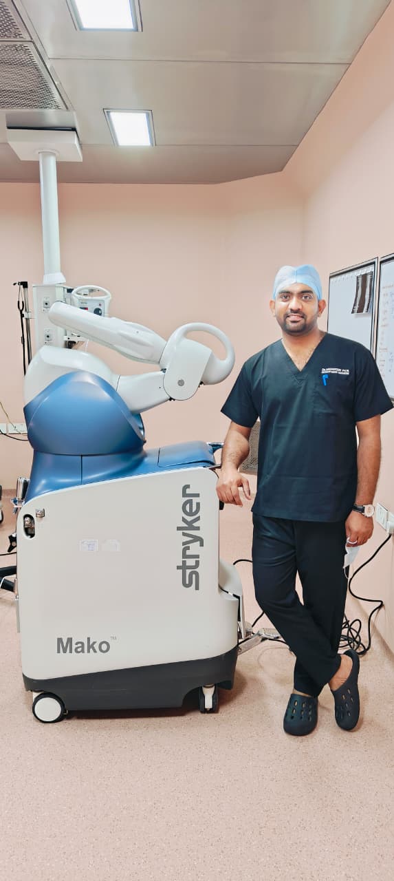 Dr Mahantesh Patil with the Stryker Mako robotic-assisted surgery system